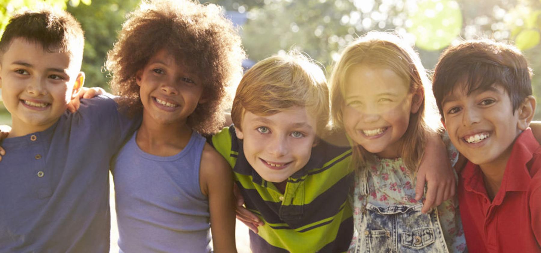 Group of kids smiling outdoors