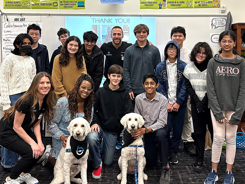 Buchwald Orthodontics team posing with middle school class