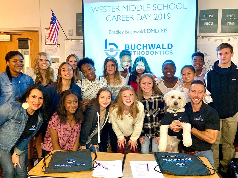 Middle school class posing with Doctor Buchwald