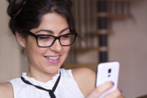 a person with braces having a virtual consultation with their orthodontist in Frisco