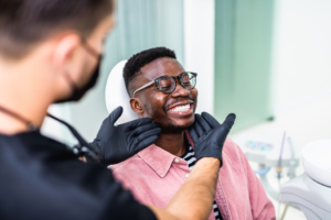 a patient smiling during their orthodontic visit 