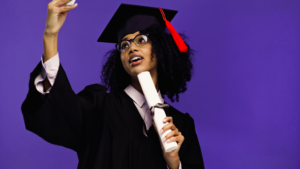 a graduating student with braces smiling